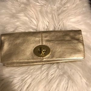 Gold coach clutch purse